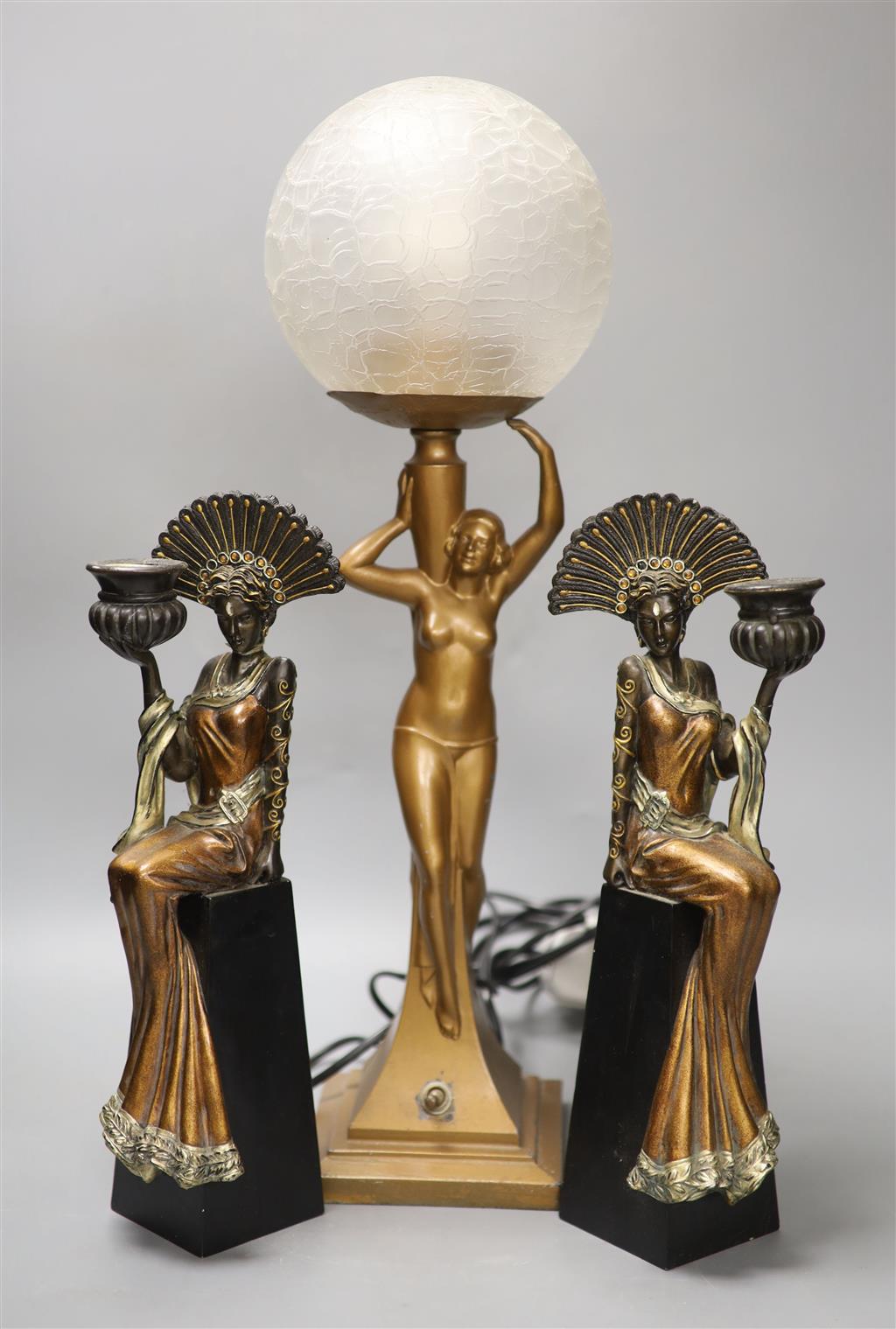 An Art Deco style figural lamp and two resin figural candlesticks, tallest 50cm